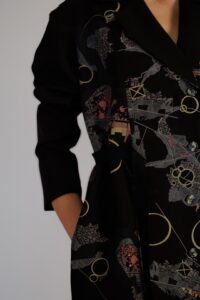 Black map coat dress